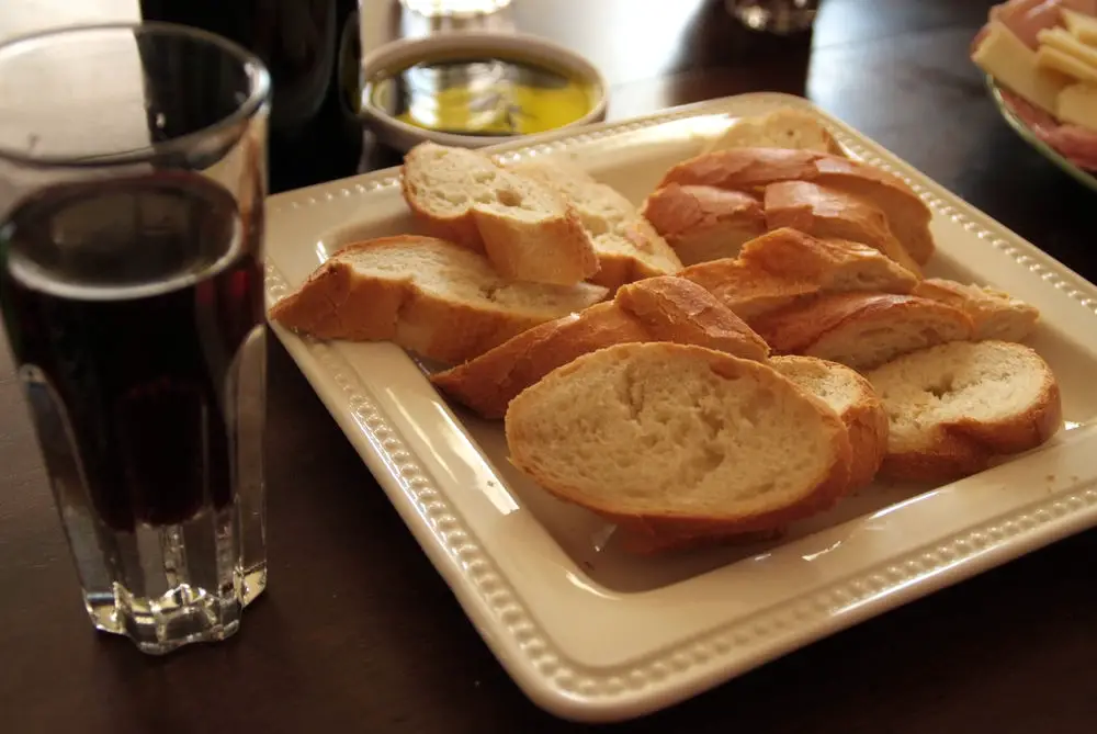 Dipping bread in wine